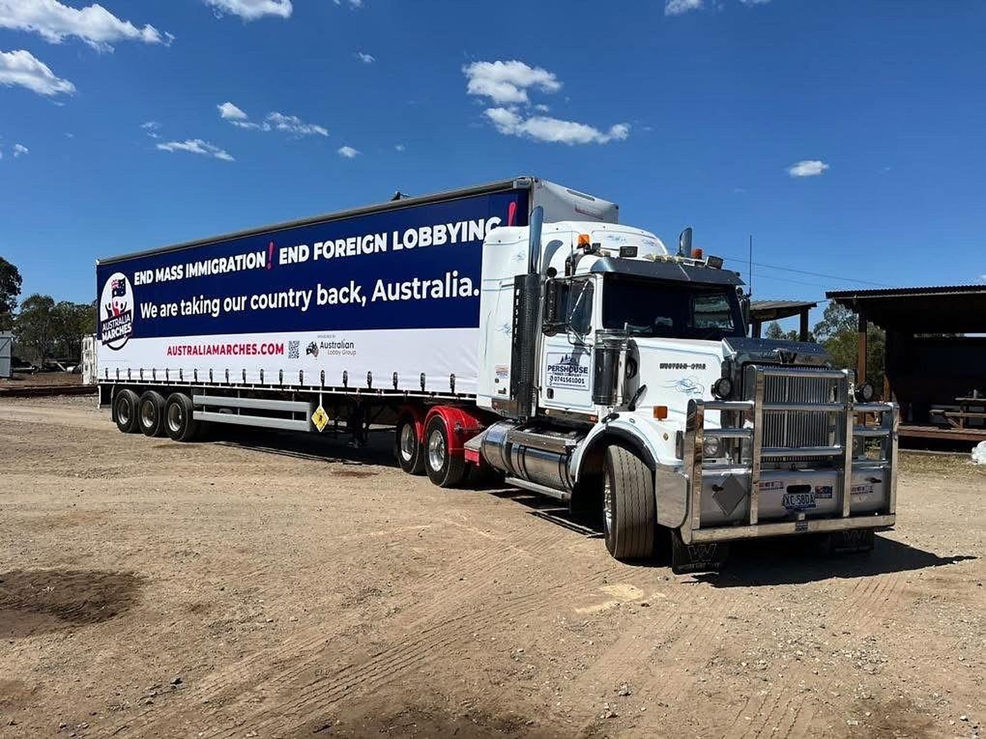 The Australia Marches 2026 National Tour truck with its End Mass Immigration, End Foreign Lobbying curtain-side signage