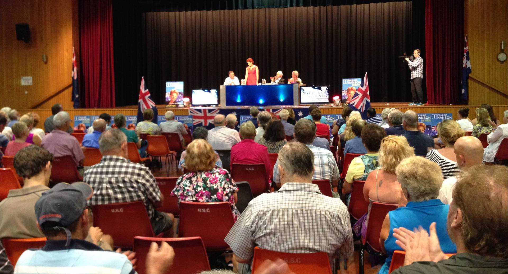 Candidate forum in a packed community hall